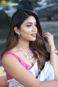 Actress Malavika Satheesan in a white saree