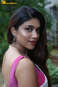 Actress Malavika Satheesan in a white saree