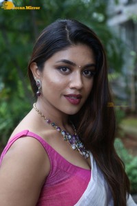 Actress Malavika Satheesan in a white saree