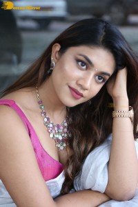 Actress Malavika Satheesan in a white saree