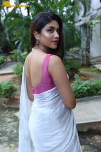 Actress Malavika Satheesan in a white saree