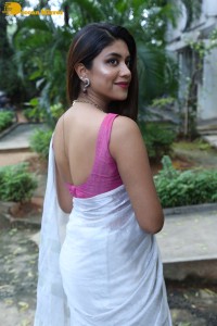 Actress Malavika Satheesan in a white saree