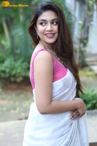 Actress Malavika Satheesan in a white saree