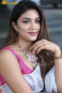 Actress Malavika Satheesan in a white saree