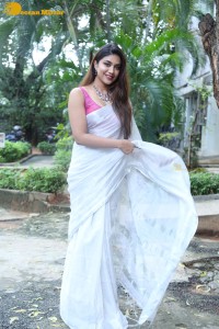 Actress Malavika Satheesan in a white saree