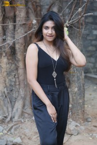 actress malavika satheesan photoshoot in a black dress