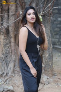 actress malavika satheesan photoshoot in a black dress
