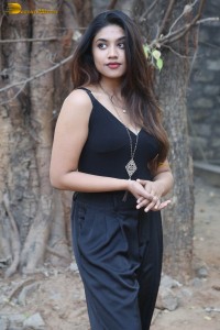actress malavika satheesan photoshoot in a black dress