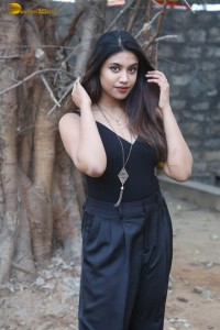 actress malavika satheesan photoshoot in a black dress