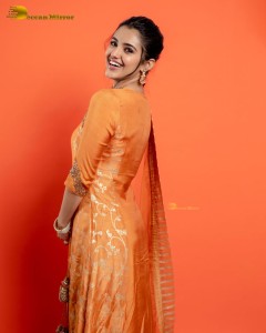 Actress Malvika Sharma in a orange salwar dress