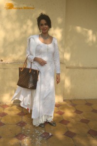 Mallika Sherawat in a white salwar kameez