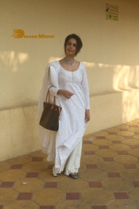 Mallika Sherawat in a white salwar kameez