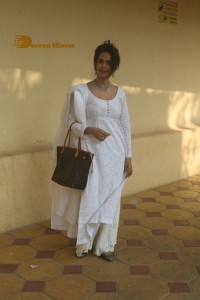 Mallika Sherawat in a white salwar kameez