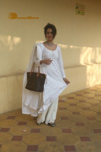 Mallika Sherawat in a white salwar kameez