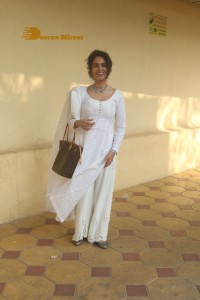 Mallika Sherawat in a white salwar kameez