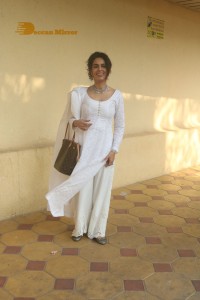 Mallika Sherawat in a white salwar kameez