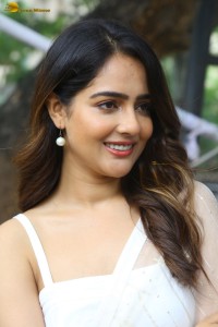 actress Malvi Malhotra in a noodle strap blouse and white saree
