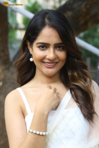 actress Malvi Malhotra in a noodle strap blouse and white saree