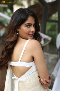 actress Malvi Malhotra in a noodle strap blouse and white saree