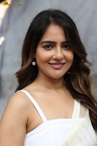 actress Malvi Malhotra in a noodle strap blouse and white saree