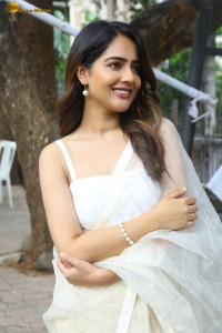 actress Malvi Malhotra in a noodle strap blouse and white saree