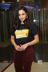 actress malvika nair in a black t-shirt and red pants