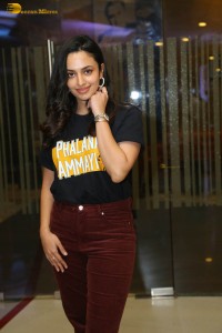 actress malvika nair in a black t-shirt and red pants