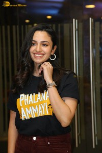 actress malvika nair in a black t-shirt and red pants