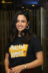 actress malvika nair in a black t-shirt and red pants