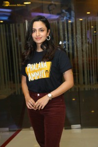 actress malvika nair in a black t-shirt and red pants