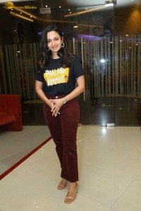 actress malvika nair in a black t-shirt and red pants