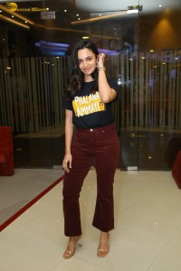 actress malvika nair in a black t-shirt and red pants