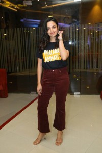actress malvika nair in a black t-shirt and red pants