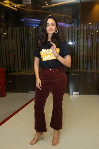 actress malvika nair in a black t-shirt and red pants