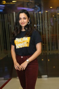 actress malvika nair in a black t-shirt and red pants