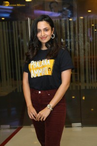 actress malvika nair in a black t-shirt and red pants