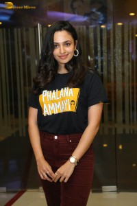 actress malvika nair in a black t-shirt and red pants