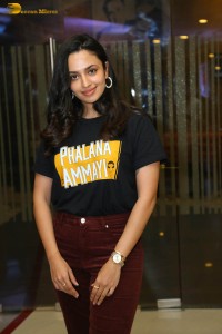 actress malvika nair in a black t-shirt and red pants