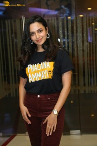 actress malvika nair in a black t-shirt and red pants