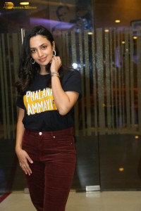 actress malvika nair in a black t-shirt and red pants