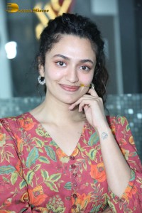 Actress malvika nair in a red colorful dress looking cute