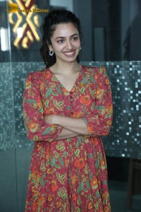 Actress malvika nair in a red colorful dress looking cute