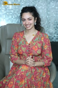 Actress malvika nair in a red colorful dress looking cute