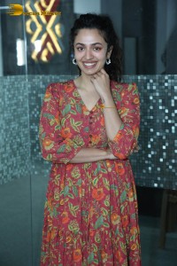 Actress malvika nair in a red colorful dress looking cute