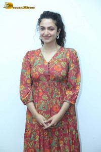 Actress malvika nair in a red colorful dress looking cute
