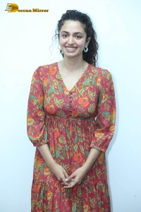 Actress malvika nair in a red colorful dress looking cute