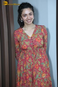 Actress malvika nair in a red colorful dress looking cute