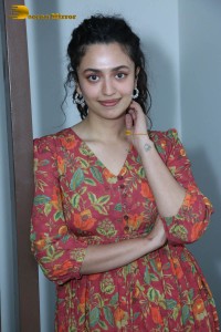 Actress malvika nair in a red colorful dress looking cute