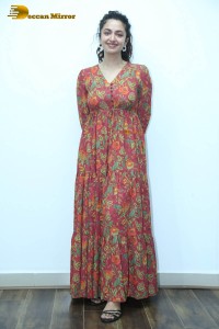 Actress malvika nair in a red colorful dress looking cute