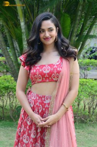 south actress malvika nair in a red lehenga choli